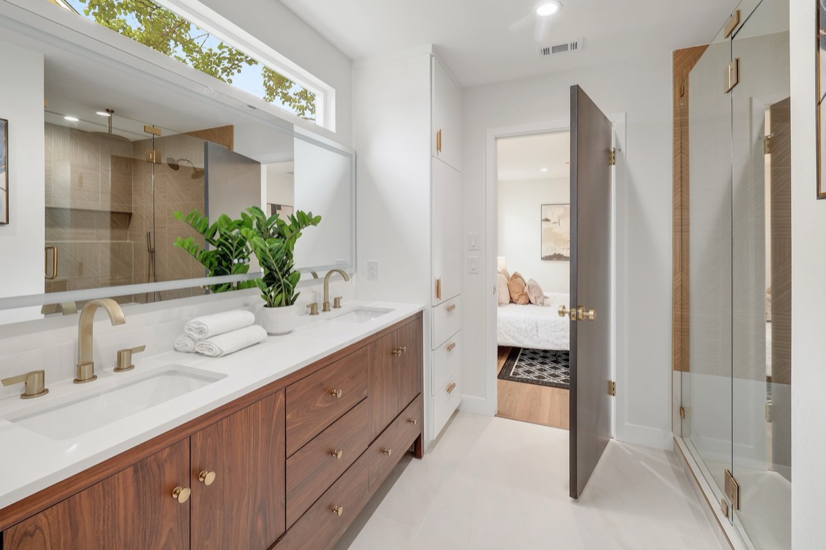 Primary bathroom with double vanity and walk-in shower