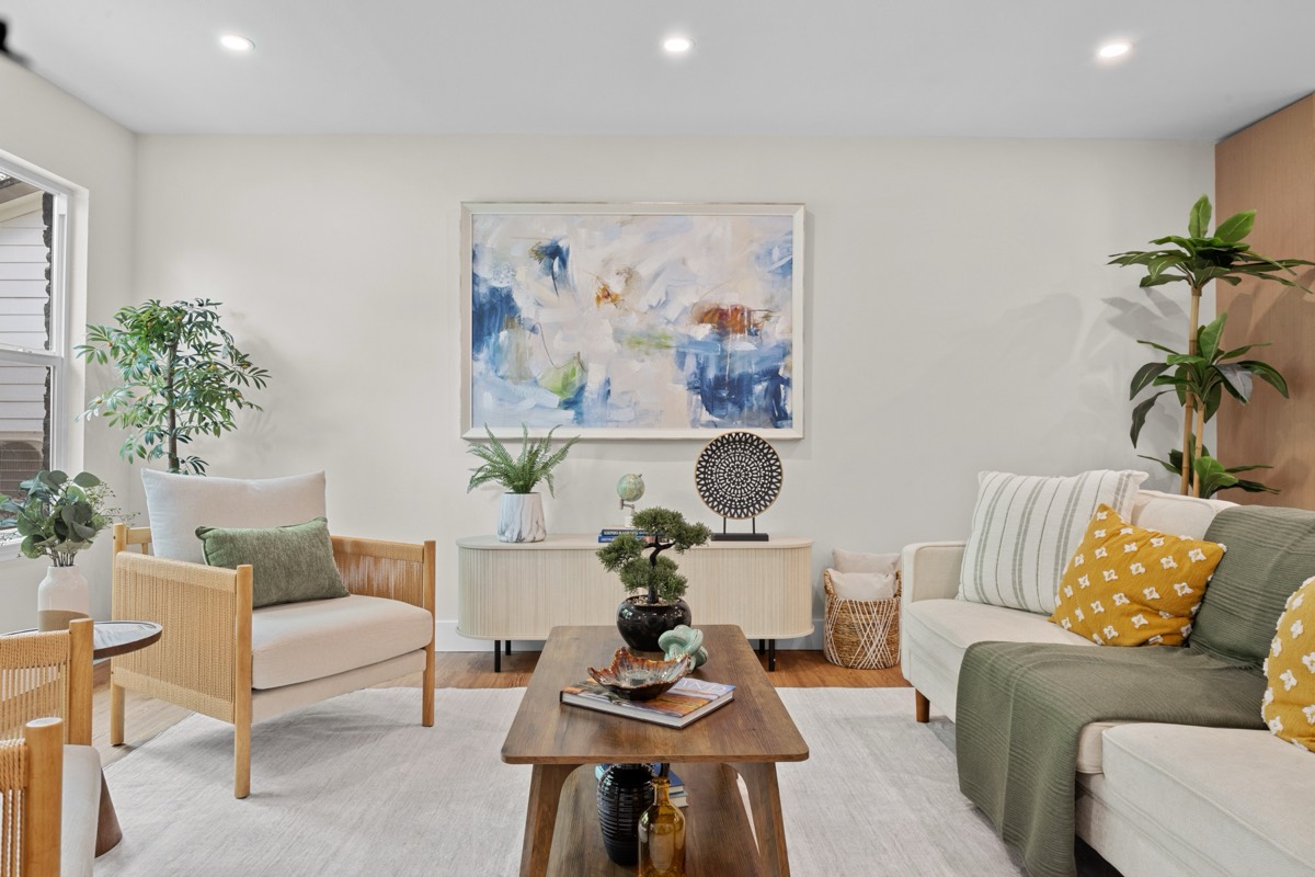 Staged living room with abstract art and natural light