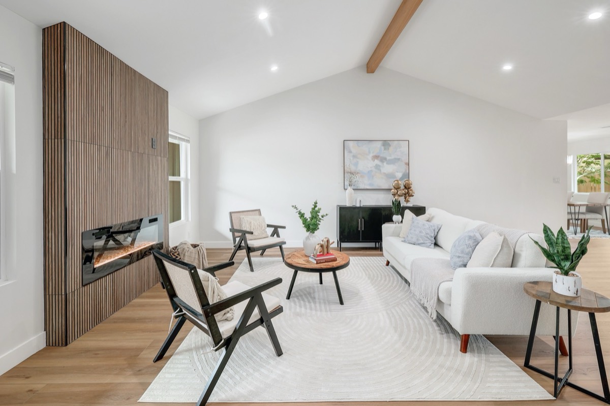Bright renovated living room with fireplace